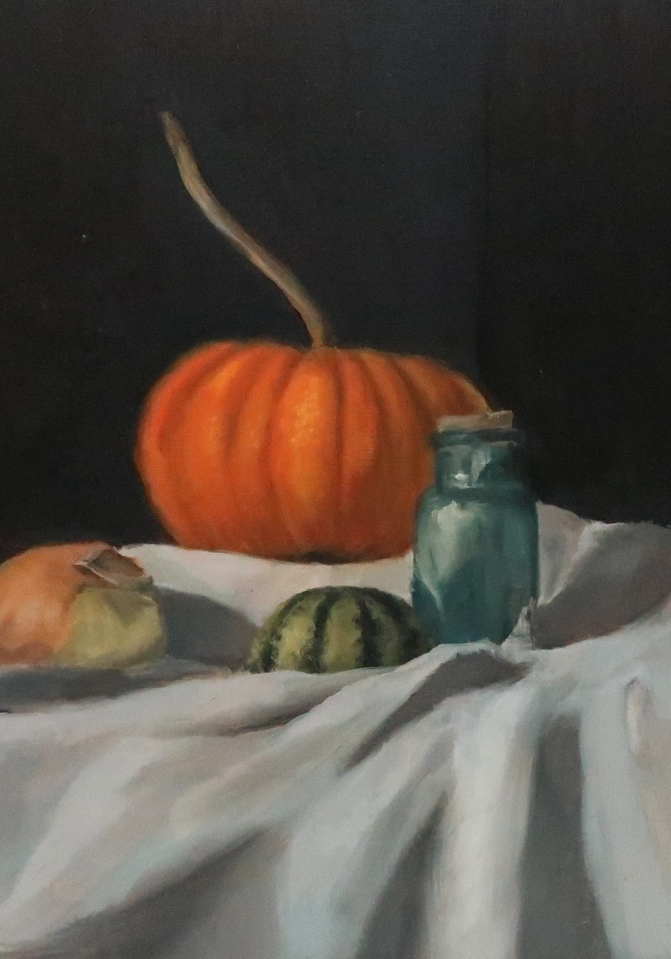 Oil painting featuring a still life arrangement of vegetables and blue glass bottle painted with oils.